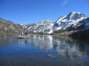 People in a boat fishing in June Lake.