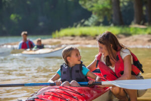 A family kayaking on their California summer vacation in June Lake.