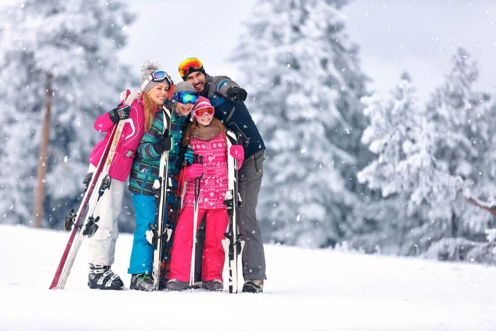 A family skiing on a June Lake vacation in winter.