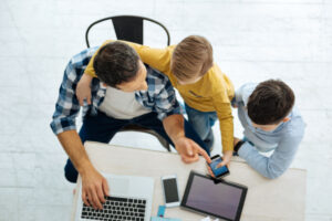 A family checking the weather in June Lake.